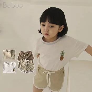 Ir 2021. Vasaras Korejas Ins Bērnu Apģērbu Komplekti Zēniem Un Meitenēm Ar Īsām Piedurknēm Topi Ar Ananāsu + Šorti 2-6 Gadus Vecas Drēbes