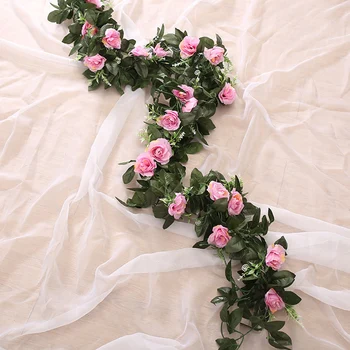 Zīda mākslīgo rožu vīnogulāju karājas ziedi sienu apdarē rotangpalmas viltus augu lapu vainags romantisku kāzu mājas apdare